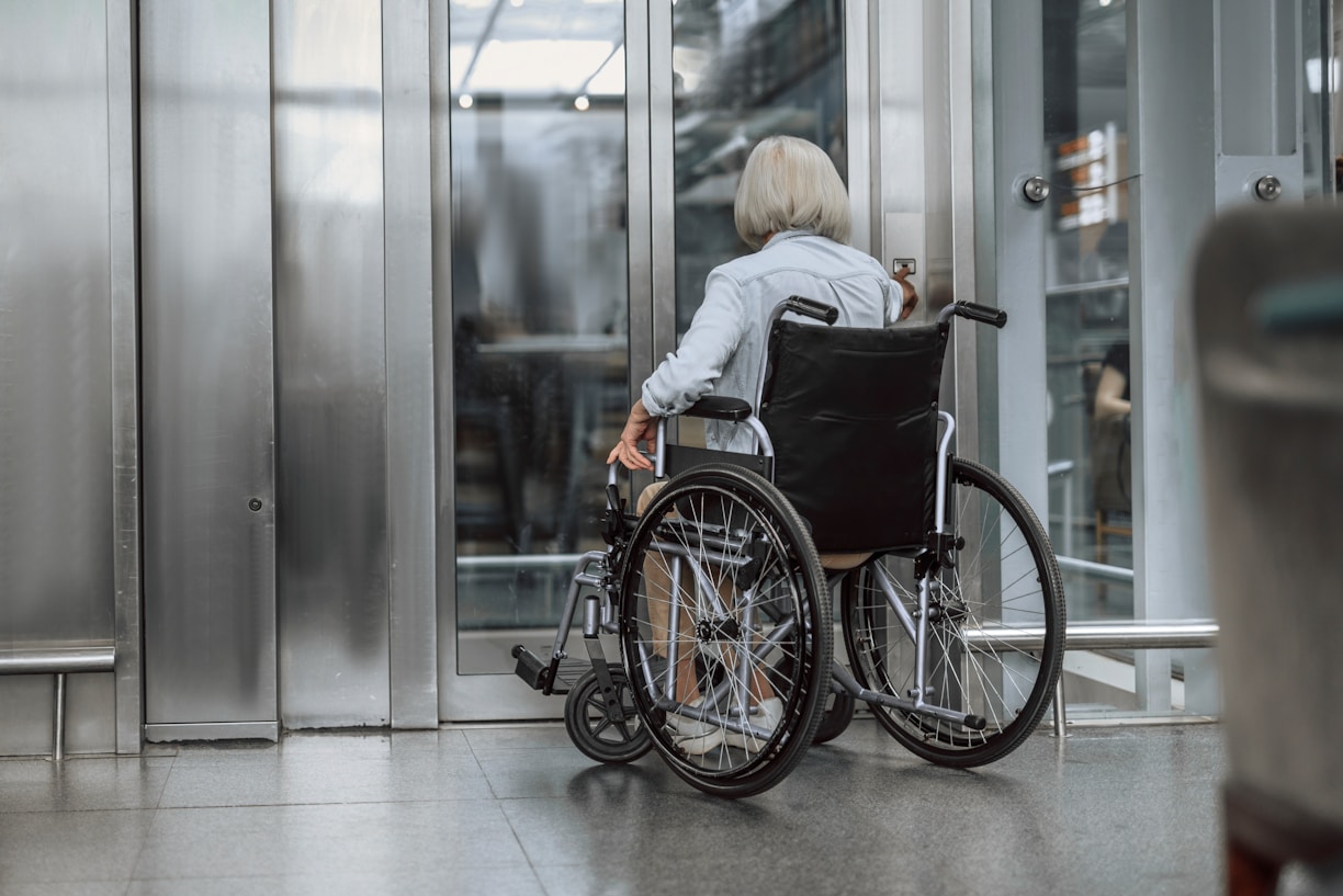 Wheelchair user entering an elevator